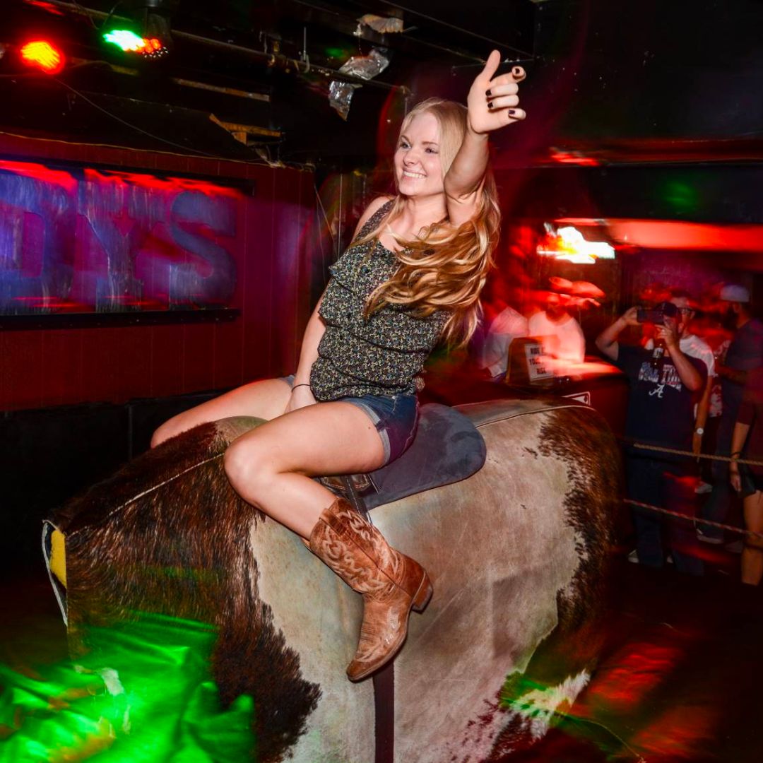 picture of a girl riding the Dirty Little Roddy's Bull